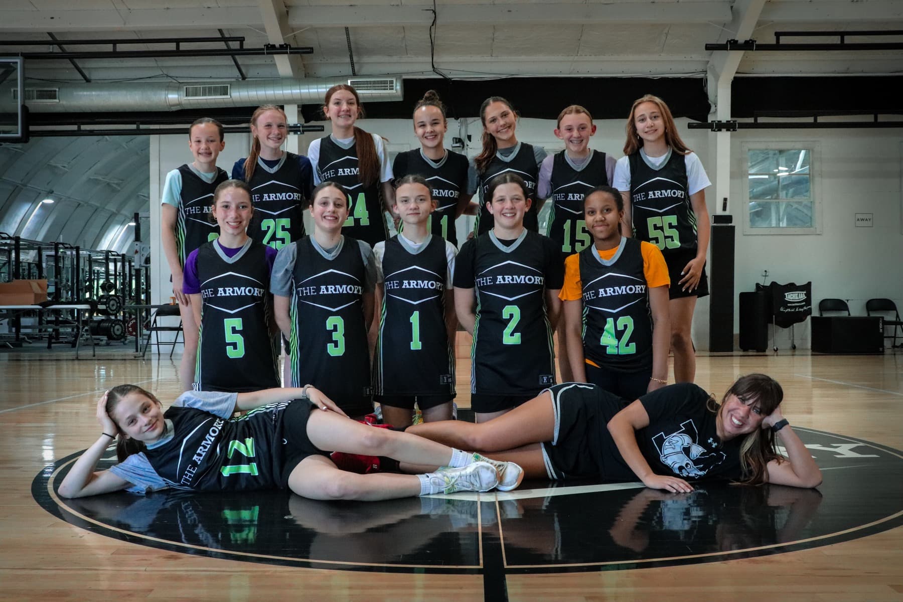 The ARMORY Basketball Club team together on the court at THE ARMORY