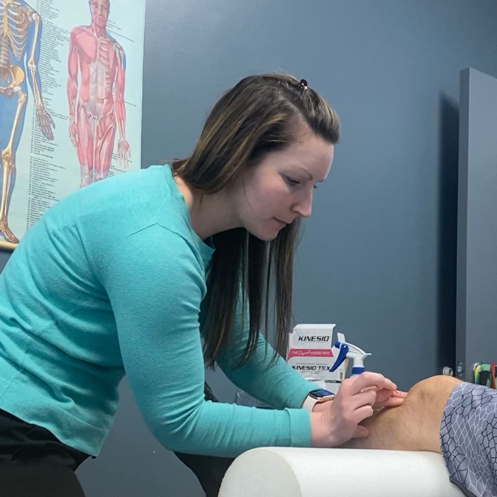 Dr. Sarah Bishop performing dry needling on a patient's knee at THE ARMORY